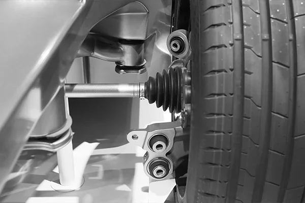 Close up of CV axle within suspension and steering system