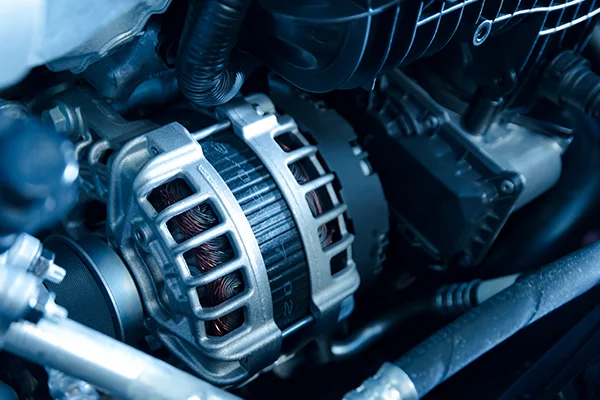 Close-up of alternator sitting in engine bay